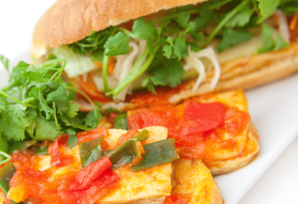 Tofu Banh Mi creates the perfect combination of crispy bread crust, delicious tofu, fresh vegetables, and rich sauce (Source: Canva)